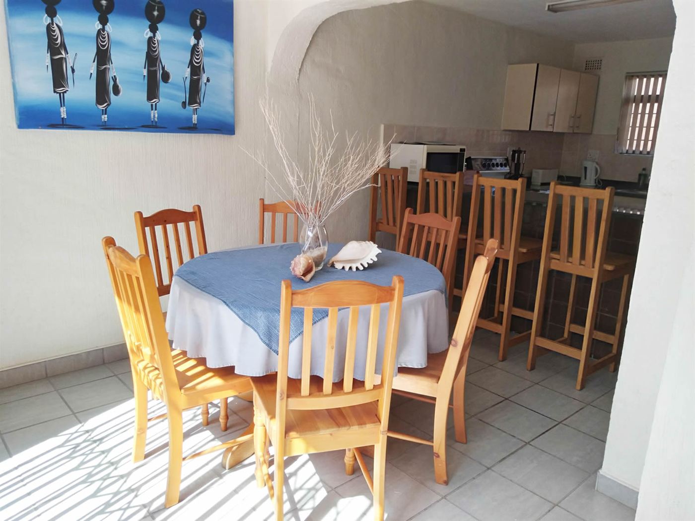 Kitchen with breakfast bar and dining table for six