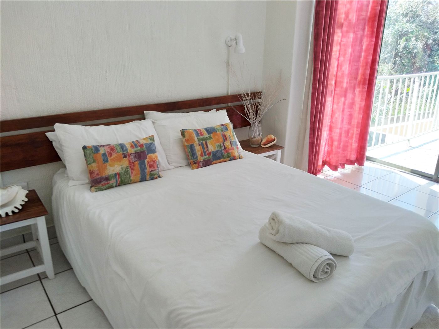 Main bedroom with double bed and balcony door
